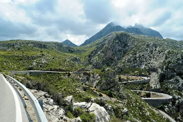 The winding road to Sa Calobra snaking through the limestone peaks of the Serra de Tramuntana