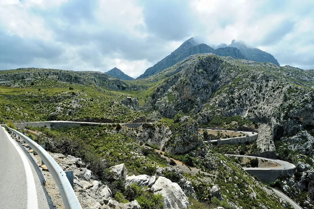 The winding road to Sa Calobra snaking through the limestone peaks of the Serra de Tramuntana