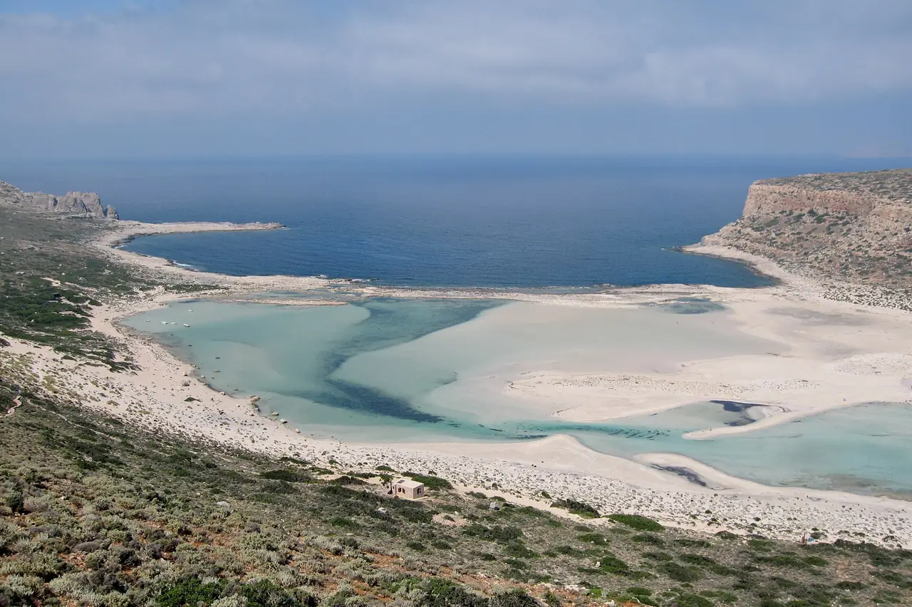 Turquoise shallow water and white sand at Balos lagoon in western Crete, seen from the hillside above
