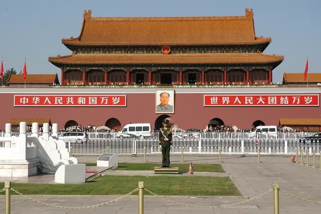 PRC soldier stands guard in front of Tiananmen (gate of heavenly peace) at the entrance to the Forbidden City in Beijing
