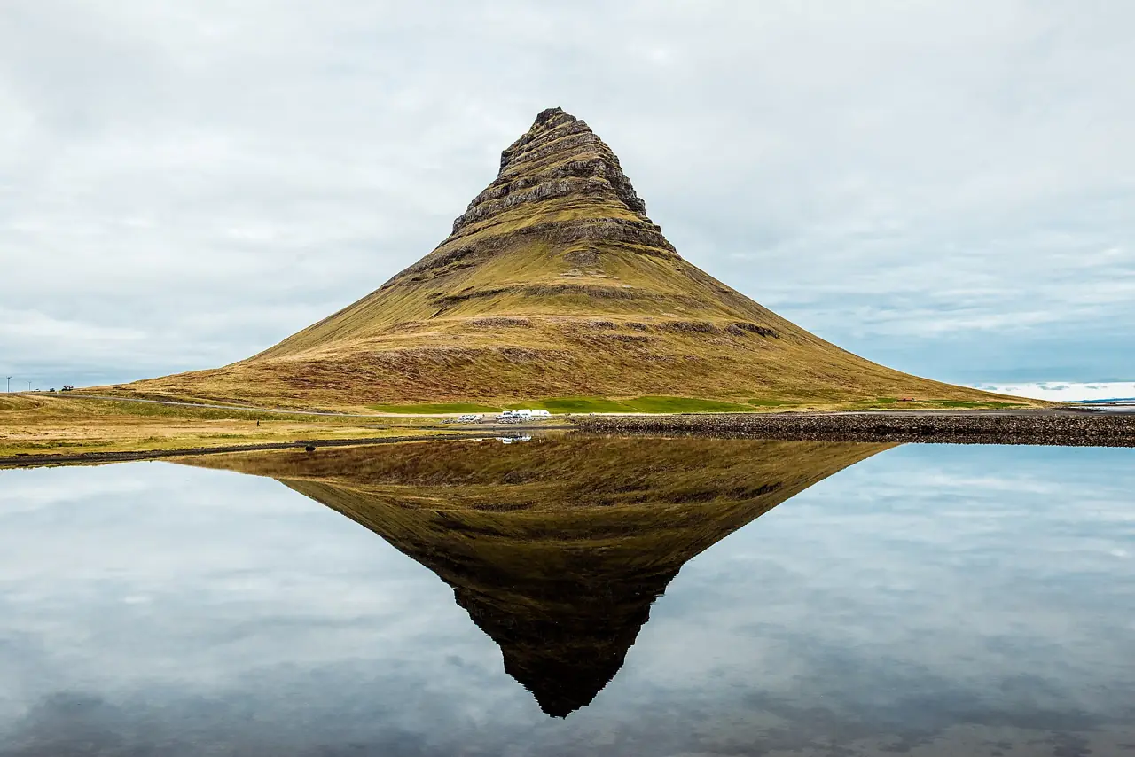 Kirkjufell mountain reflected in still water on the Snæfellsnes peninsula in west Iceland