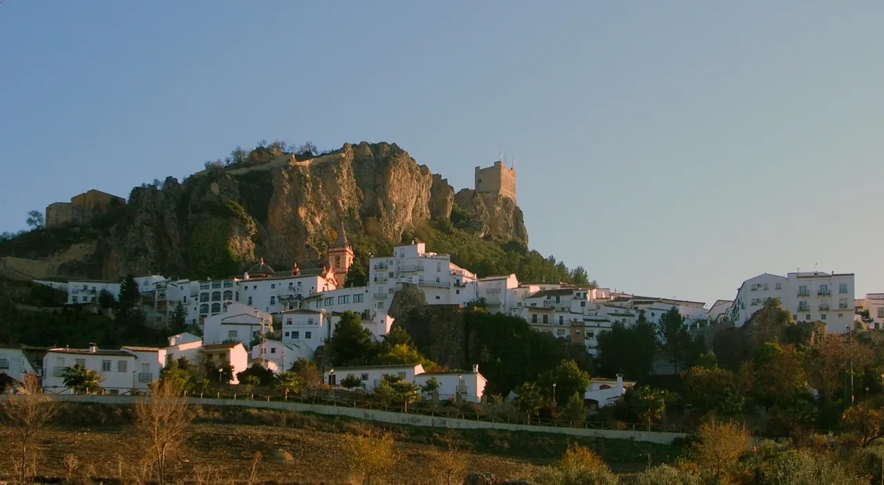 The white village of Zahara de la Sierra beneath its hilltop castle in Andalucía