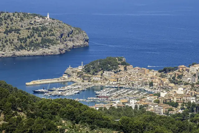 The horseshoe bay and harbour of Port de Sóller on Mallorca's north-west coast, surrounded by wooded hills