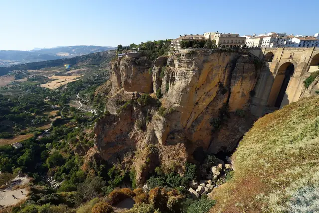 The Puente Nuevo bridge and the town of Ronda perched on cliffs above the El Tajo gorge in Andalucía