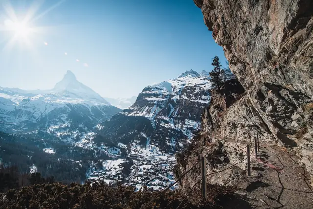 The Matterhorn rising above the snow-covered village of Zermatt on a sunny winter day