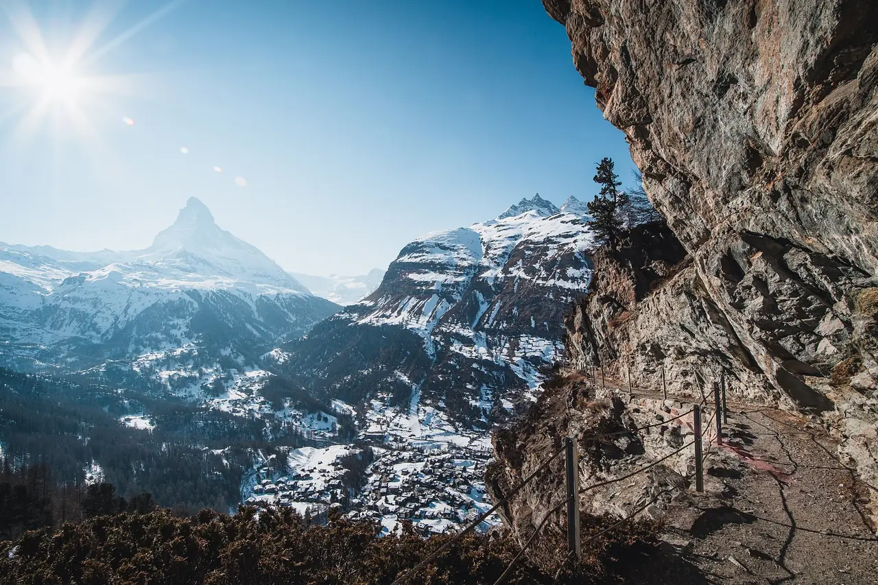 The Matterhorn rising above the snow-covered village of Zermatt on a sunny winter day