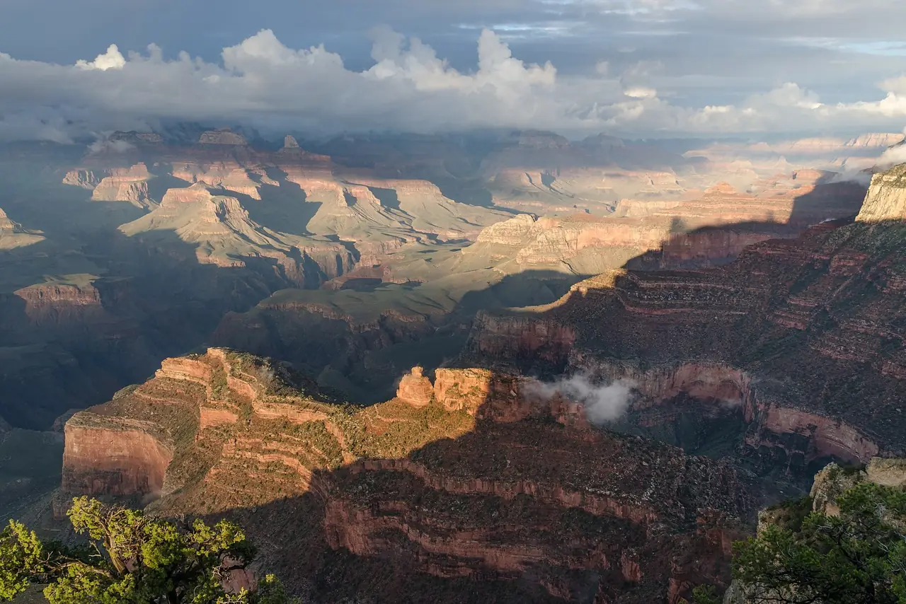 Evening light on the layered red rock buttes and canyons of the Grand Canyon seen from Powell Point on the South Rim